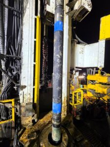 Deployment of One Shot Cementing System on a deep mining site in Australia, showing casing cemented in a single run in a challenging open-hole, using an inflatable packer, streamlining downhole operations and improving efficiency
