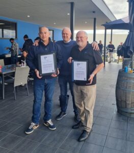 Founder and CEO Clem Rowe presents Francis Ford, Australian Director and Group Engineering Director, and Howard Kenworthy, our Commercial Director, with 20 years service award.