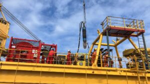 Custom inflatable packer suspended above offshore platform before conductor cutting deployment in the North Sea