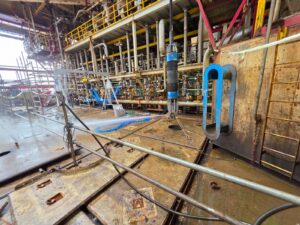 Custom inflatable packer supporting offshore conductor cutting during a North Sea plug and abandonment campaign