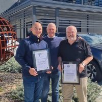 Founder and CEO Clem Rowe presents Francis Ford, Australian Director and Group Engineering Director, and Howard Kenworthy, our Commercial Director, with 20 year service gifts